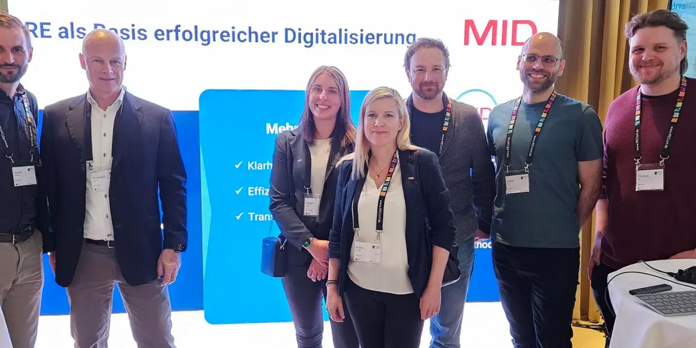 REConf 2026 | Team der MID GmbH am Messestand auf der REConf® 2026 in München mit Vorträgen zu KI und Traceability im Requirements Engineering | MID GmbH